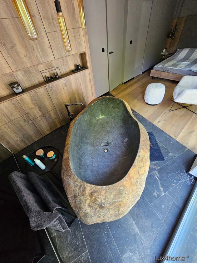Bath tubs and vessel sinks made of natural stone